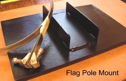Cast flag pole mount, welded to plaque back